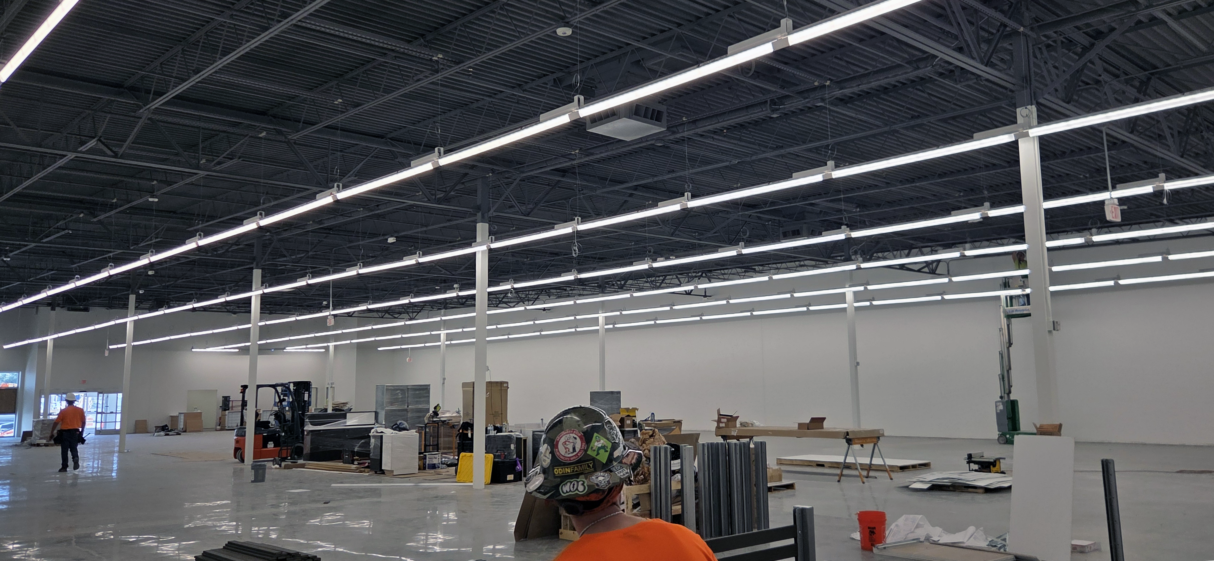 Commercial interior lighting across an active build-out